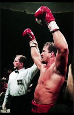 MORRISON V RUDDOCK RON HOLDING UP MORRISON'S ARM.jpg